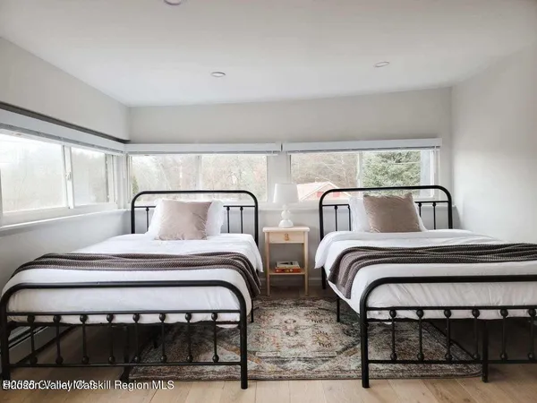 a bedroom with a bed and window