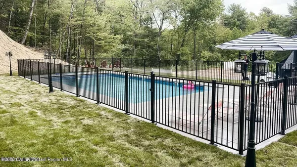 a view of a wrought iron fences in front of house