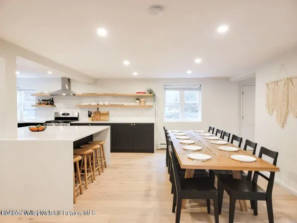 a kitchen with a table and chairs in it