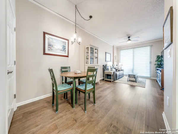 a view of a dining room with furniture and wooden floor