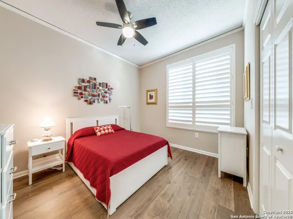 a bedroom with a large bed and a window