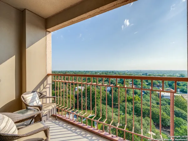 a view of balcony with chairs