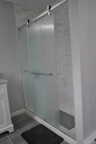 a bed room with a bed and a chandelier