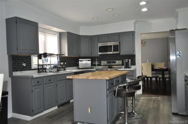 a view of front door and porch with wooden floor