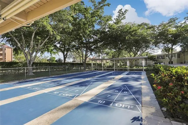 a view of outdoor space with signage and flags