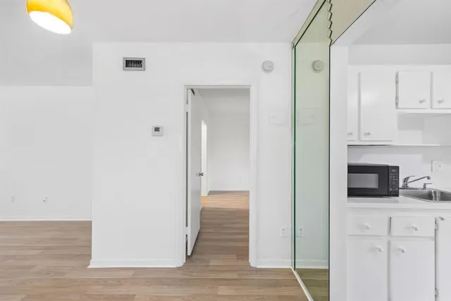 a view of a kitchen from the hallway