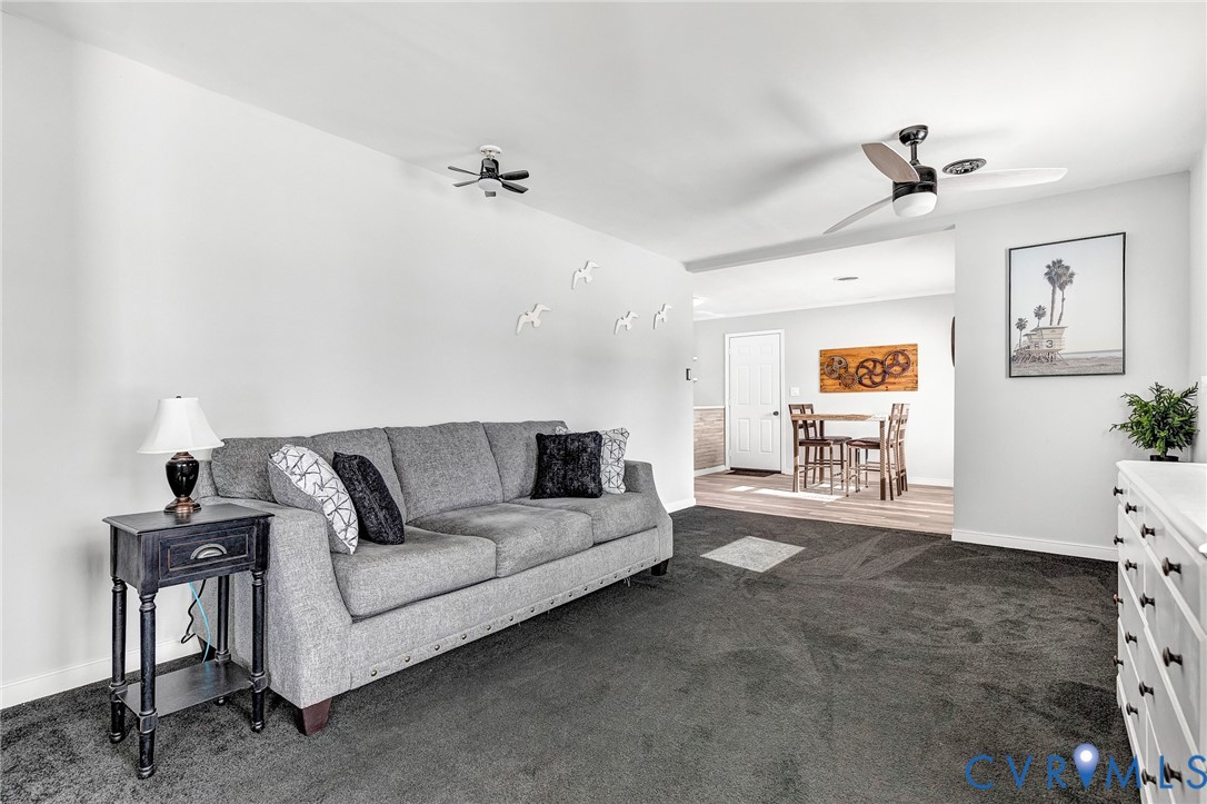 15200 Chieftain Road Disputanta, VA 23842 - Photo 15 of 44 a living room with furniture and a ceiling fan