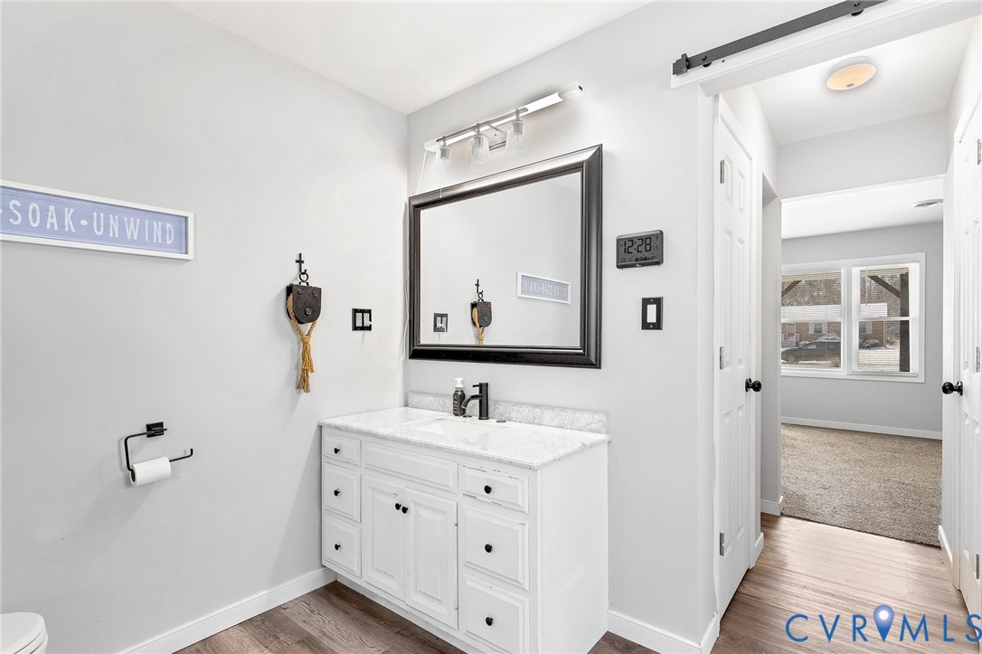 15200 Chieftain Road Disputanta, VA 23842 - Photo 24 of 44 a bathroom with a double vanity sink mirror and