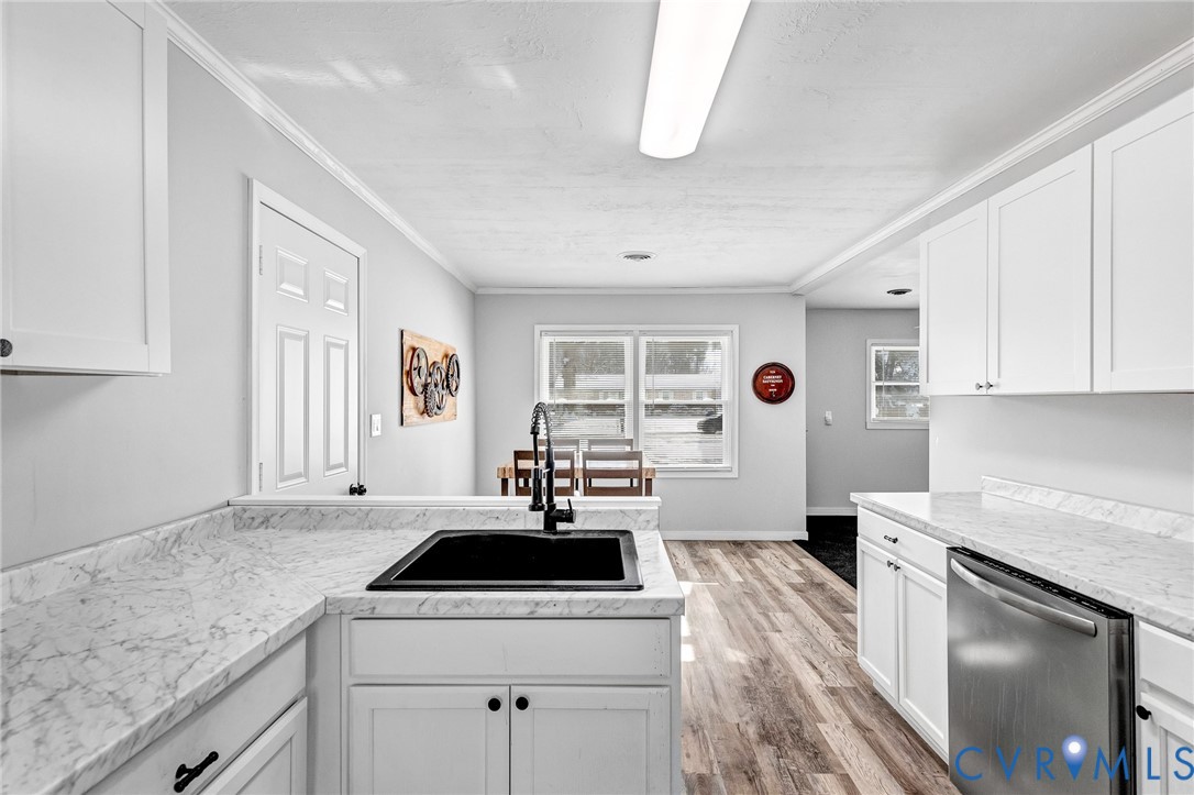 15200 Chieftain Road Disputanta, VA 23842 - Photo 7 of 44 a kitchen with a stove a sink and a refrigerator