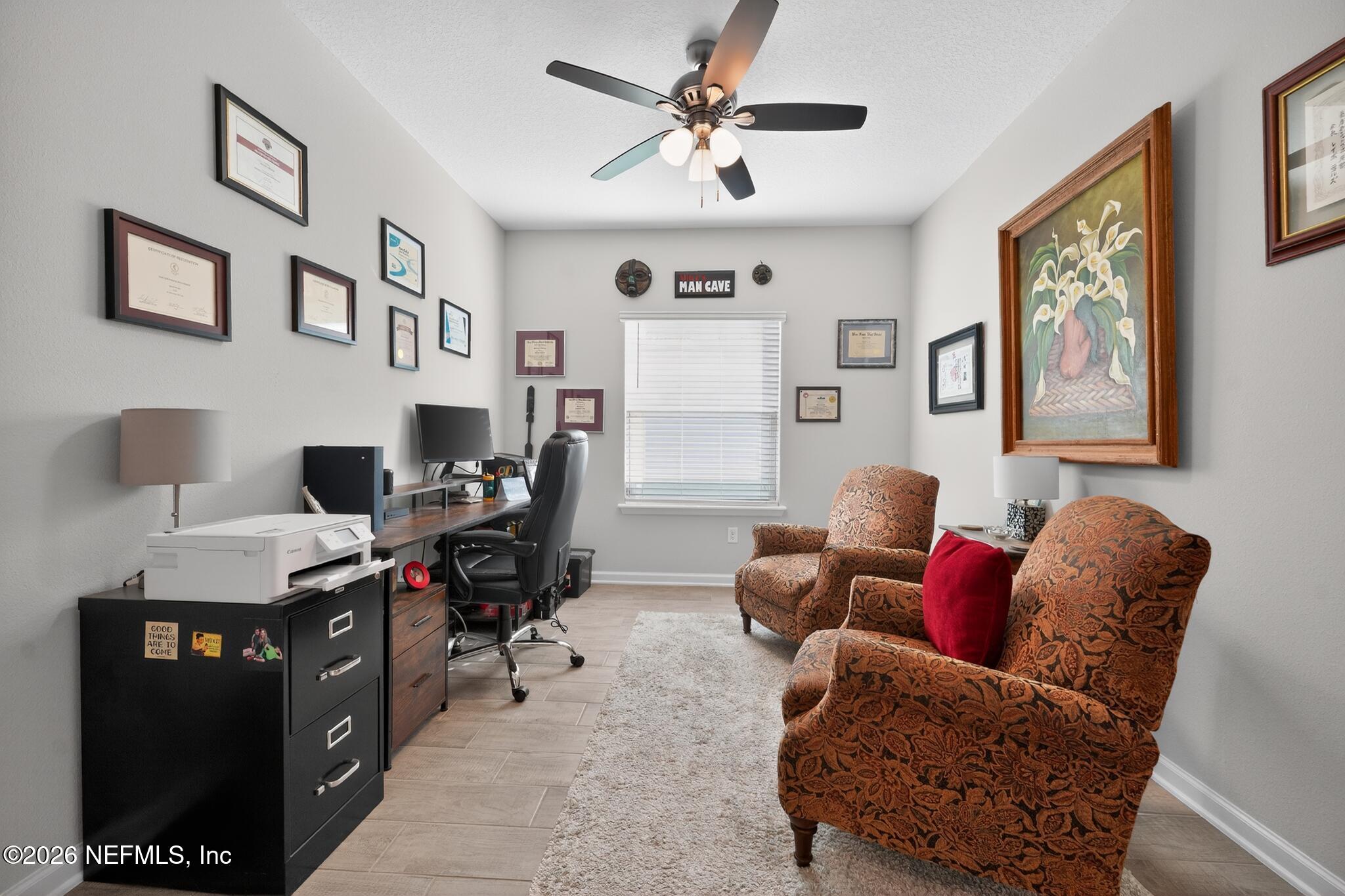 75505 Banyan Way Yulee, FL 32097 - Photo 28 of 30 a livingroom with workspace couch and a window