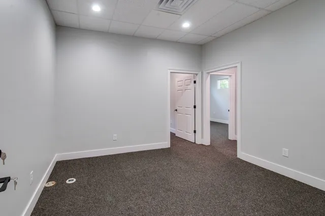 an empty room with closet area