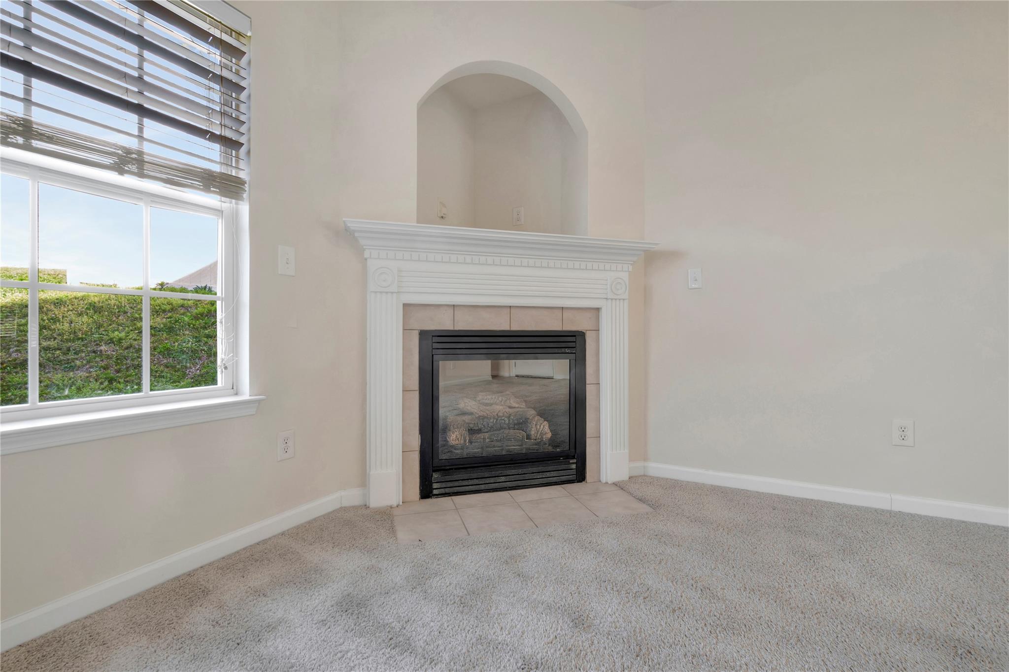 3008 Clover Road Northwest Concord, NC 28027 - Photo 11 of 45 an empty room with windows and fireplace