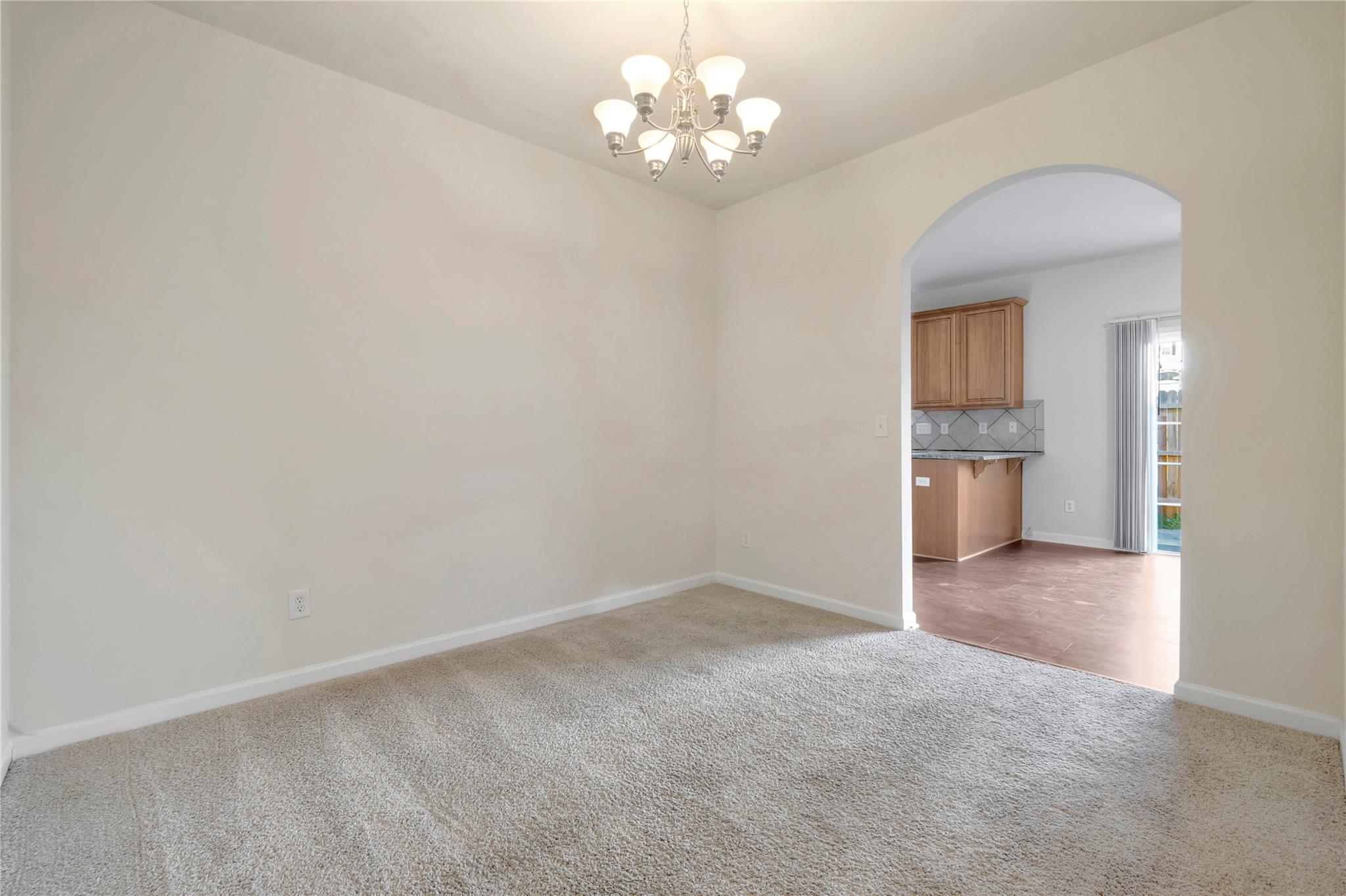 3008 Clover Road Northwest Concord, NC 28027 - Photo 13 of 45 a view of an empty room with a chandelier fan