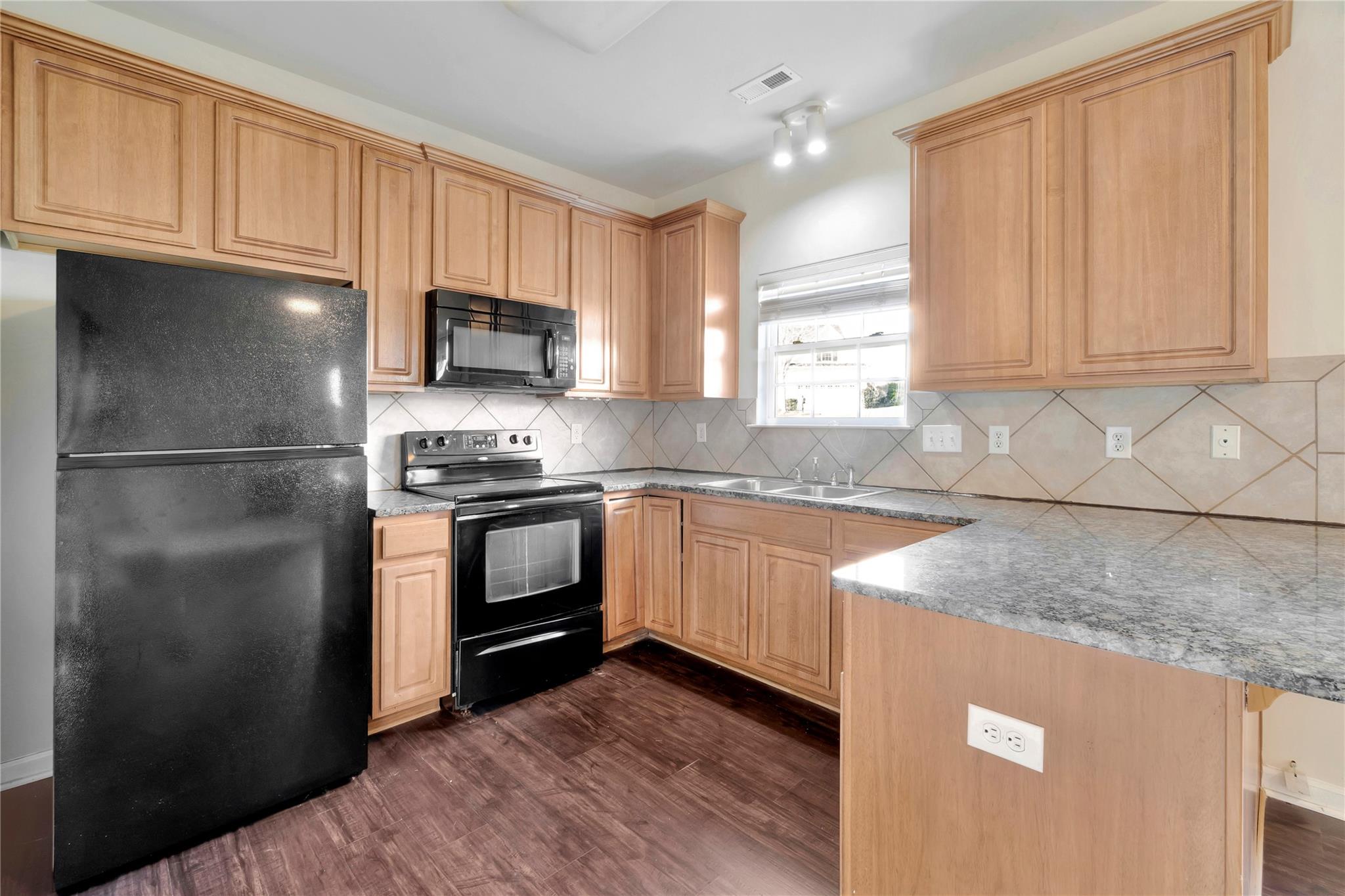 3008 Clover Road Northwest Concord, NC 28027 - Photo 16 of 45 a kitchen with granite countertop a refrigerator stove top oven and sink