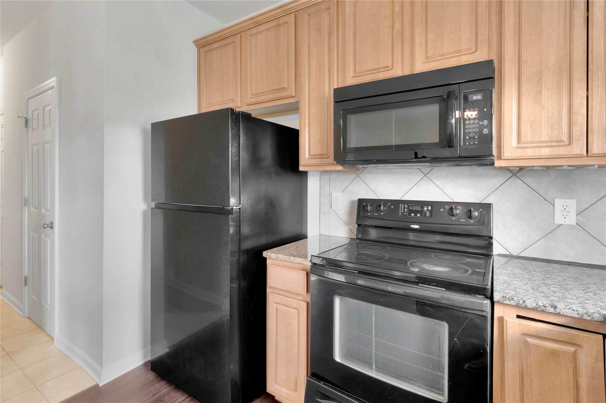3008 Clover Road Northwest Concord, NC 28027 - Photo 19 of 45 a kitchen with a stove microwave and refrigerator