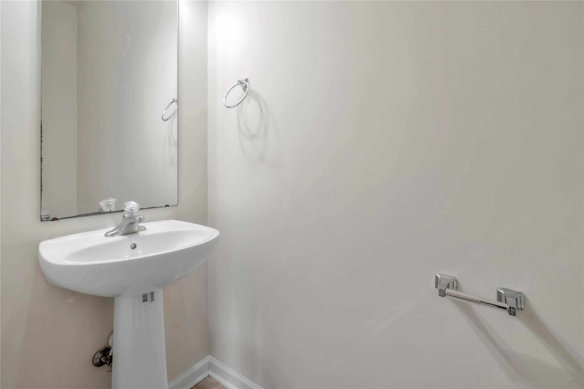 3008 Clover Road Northwest Concord, NC 28027 - Photo 21 of 45 a bathroom with a sink a mirror and a shower