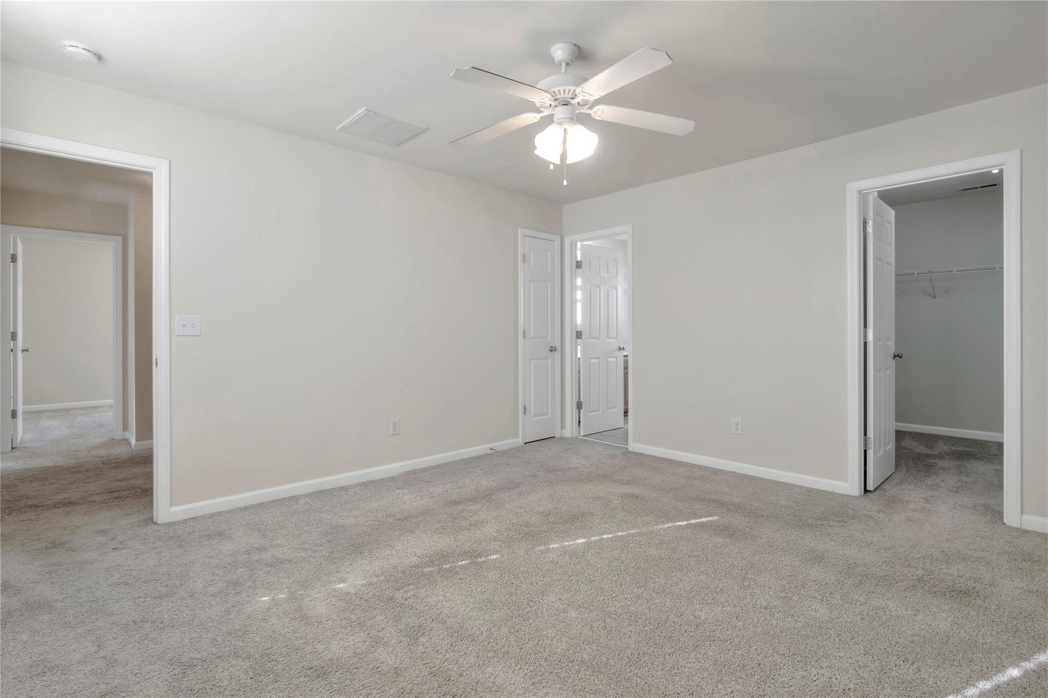 3008 Clover Road Northwest Concord, NC 28027 - Photo 22 of 45 an empty room with a ceiling fan and a bathroom