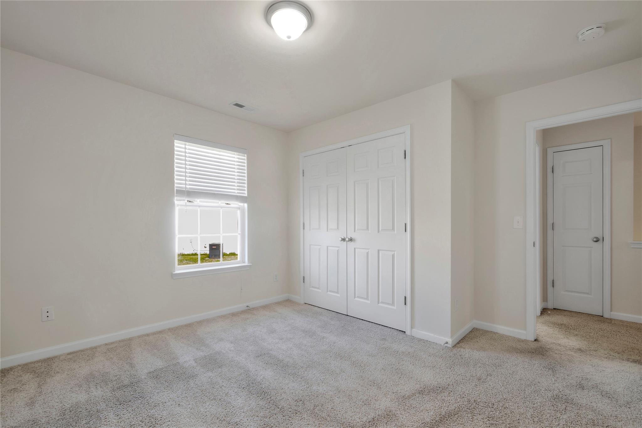 3008 Clover Road Northwest Concord, NC 28027 - Photo 27 of 45 an empty room with windows