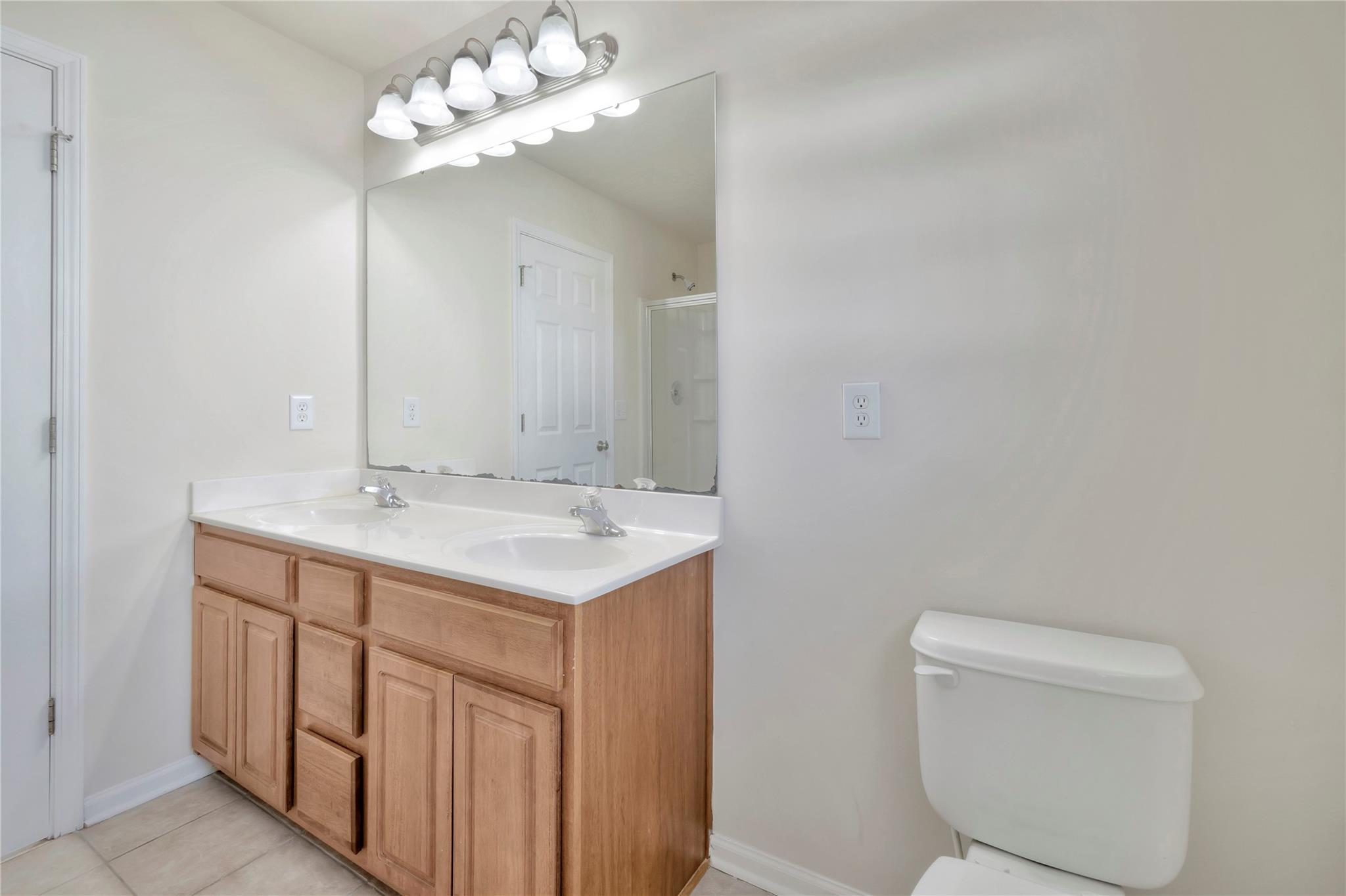 3008 Clover Road Northwest Concord, NC 28027 - Photo 32 of 45 a bathroom with a toilet sink and mirror