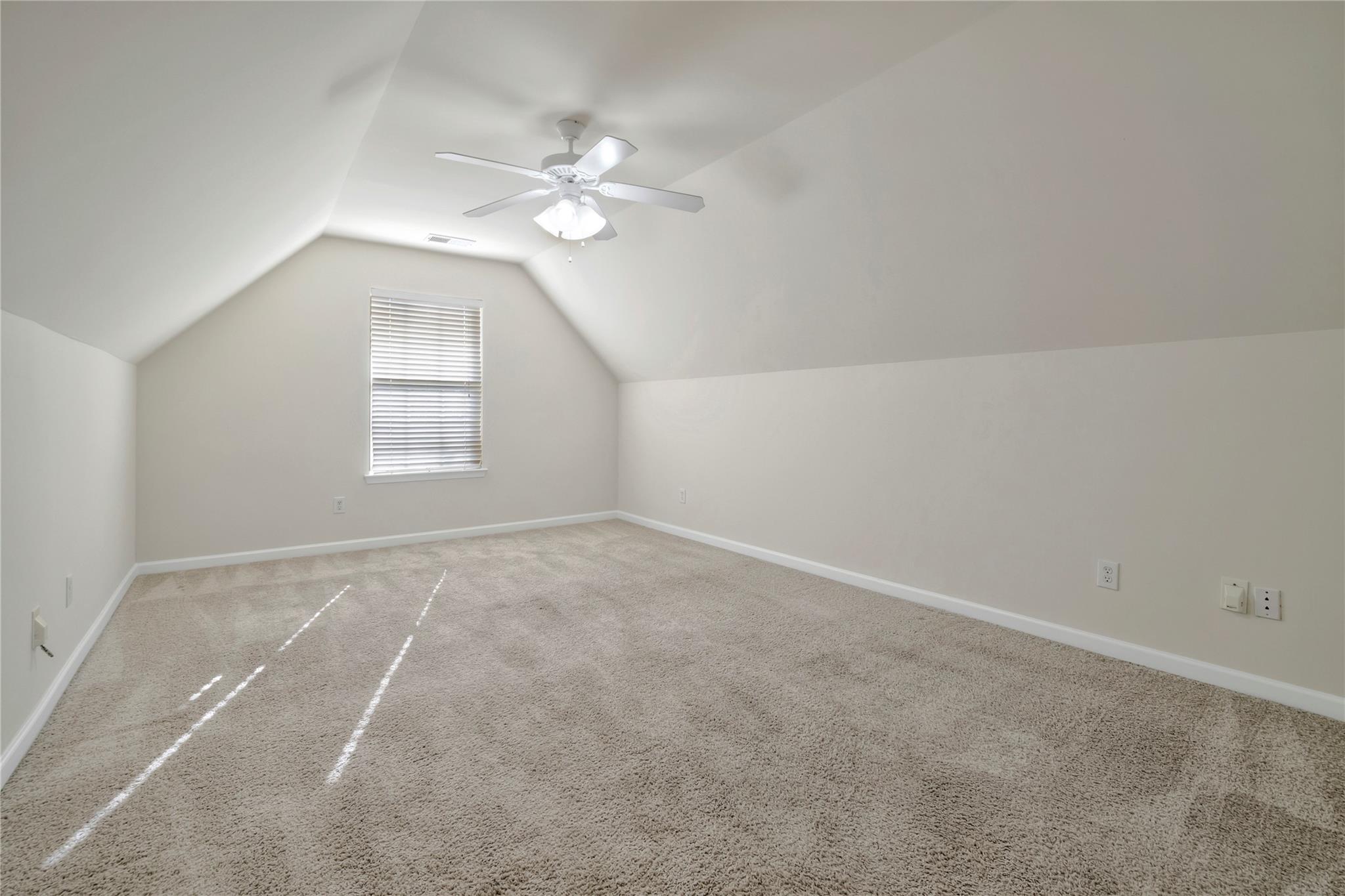 3008 Clover Road Northwest Concord, NC 28027 - Photo 35 of 45 an empty room with windows and chandelier fan