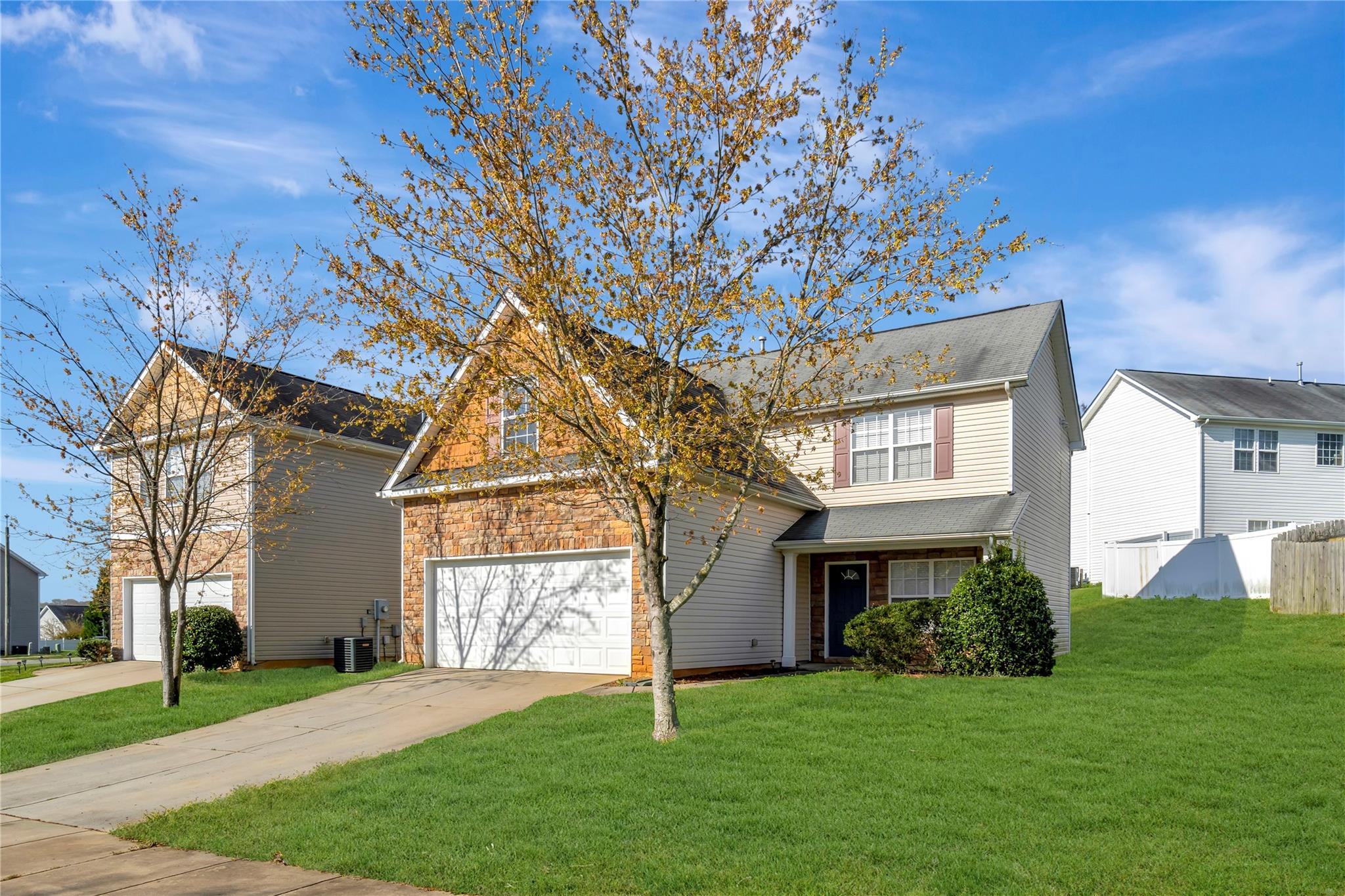 3008 Clover Road Northwest Concord, NC 28027 - Photo 5 of 45 a front view of a house with a garden and trees