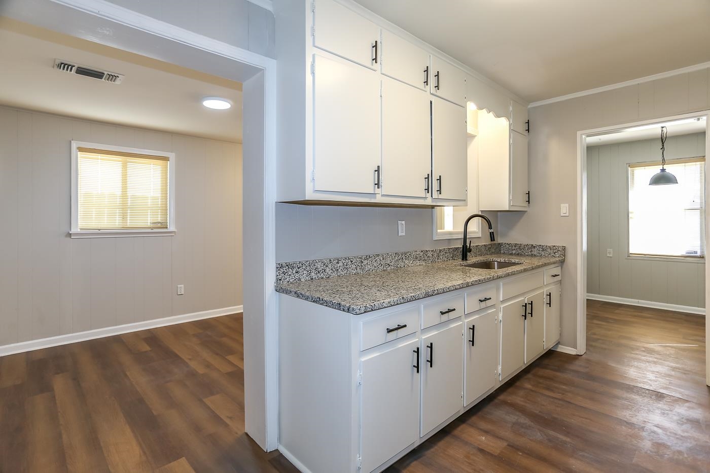 4960 Quince Road Memphis, TN 38117 - Photo 3 of 38 a kitchen with granite countertop a sink stove and cabinets