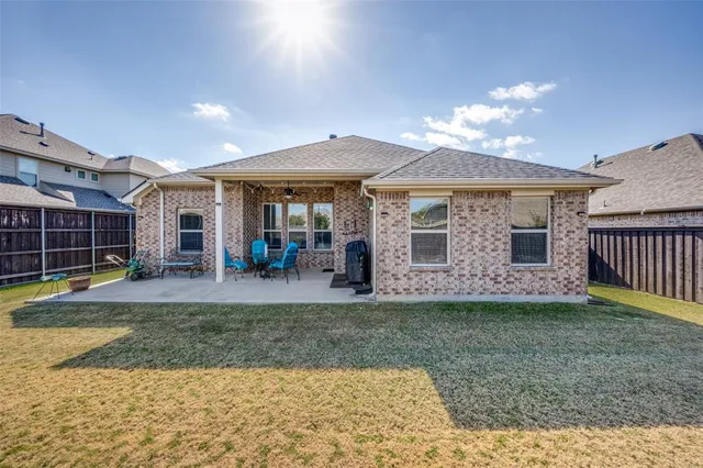 a view of a house with a yard and porch