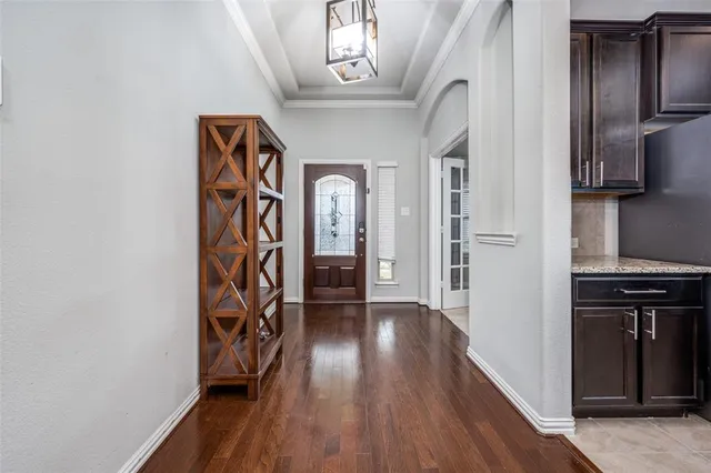 a view of an entryway with wooden floor