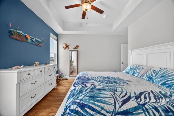 a bedroom with a bed and a dresser