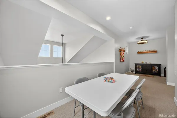 a room with a table and chairs