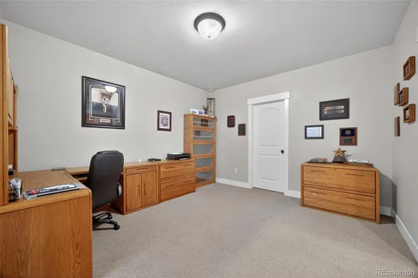 a view of workspace with furniture and windows
