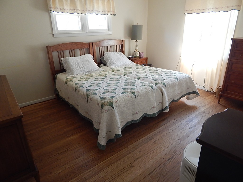 50 Searle Road South Hadley, MA 01075 - Photo 13 of 30 a large bed sitting in a bedroom next to a window