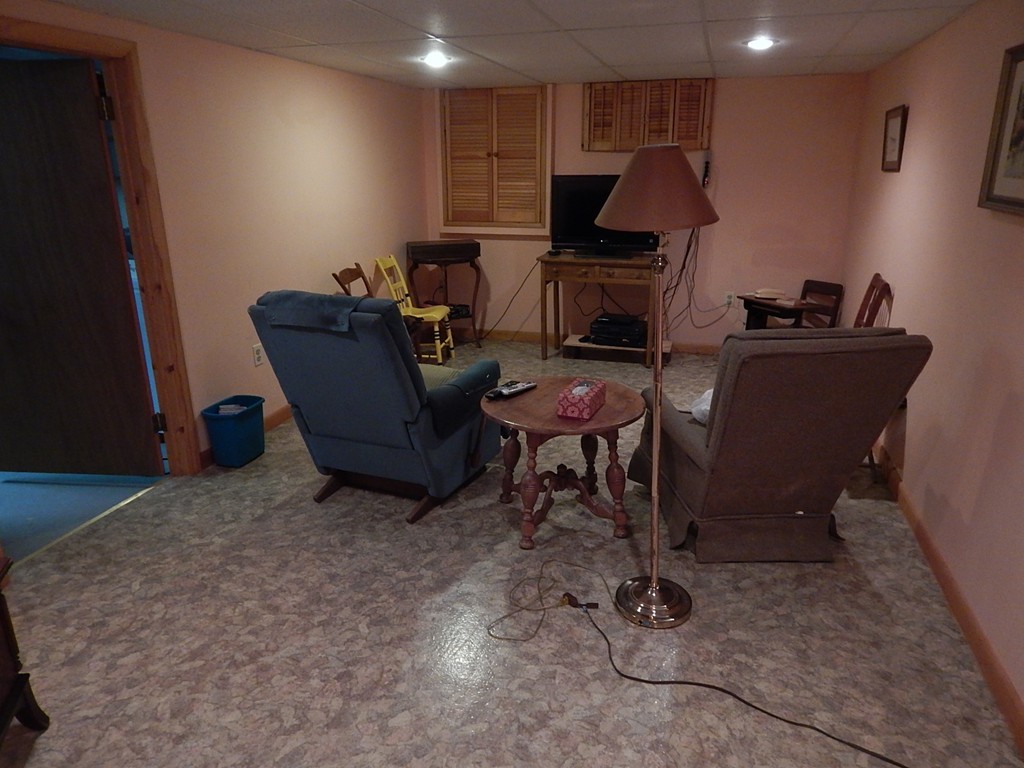 50 Searle Road South Hadley, MA 01075 - Photo 19 of 30 a living room with furniture a flat screen tv and a lamp