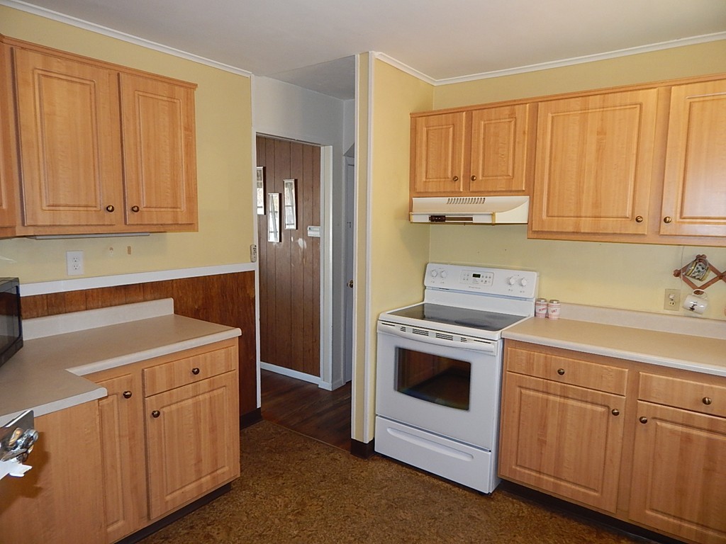 50 Searle Road South Hadley, MA 01075 - Photo 3 of 30 a kitchen with white cabinets and white appliances