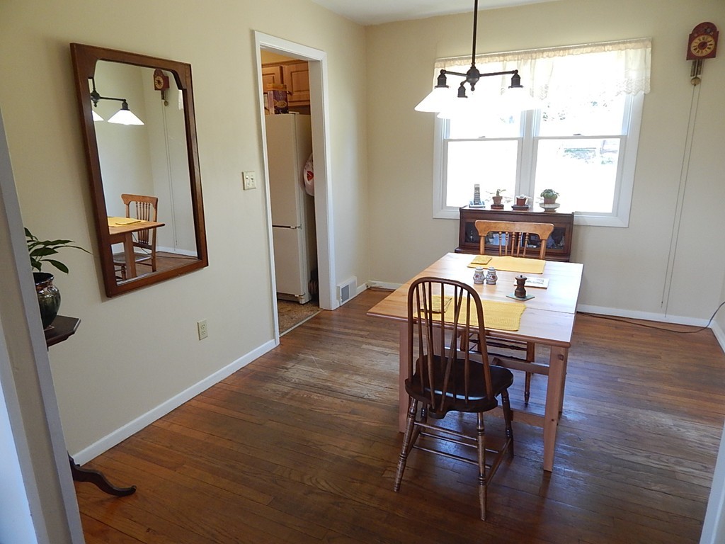 50 Searle Road South Hadley, MA 01075 - Photo 5 of 30 a view of a dining room with furniture window and wooden floor