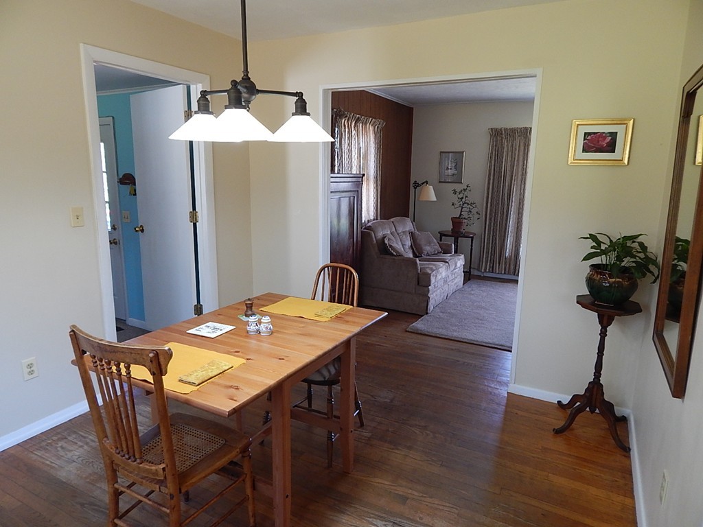 50 Searle Road South Hadley, MA 01075 - Photo 6 of 30 a view of a dining room with furniture and wooden floor