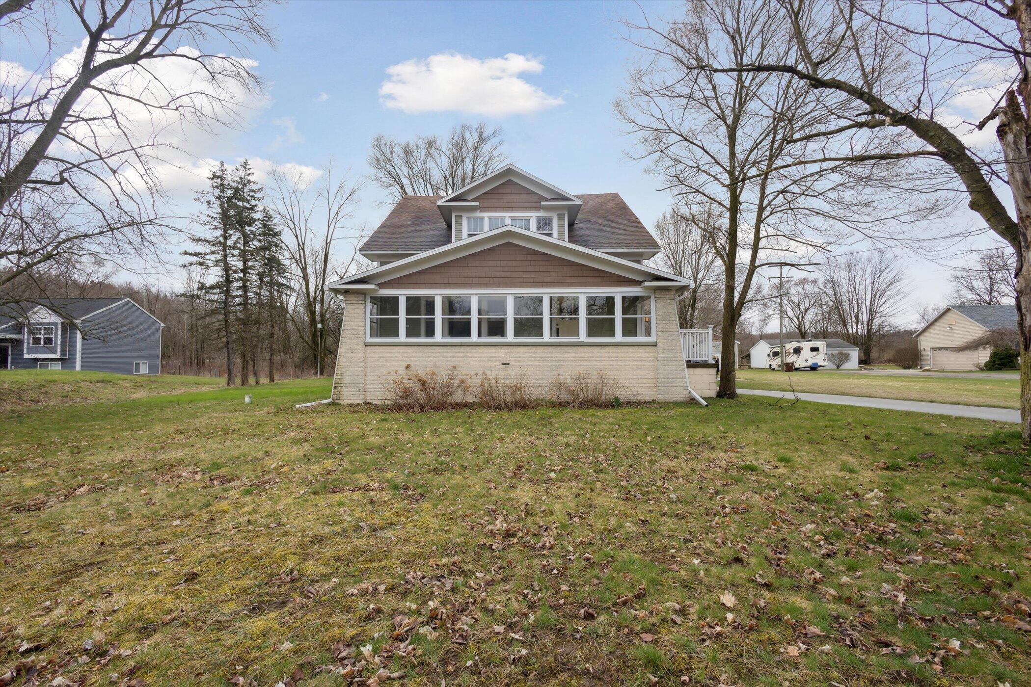 1052 10 Mile Road Northwest Sparta, MI 49345 - Photo 1 of 42 Front