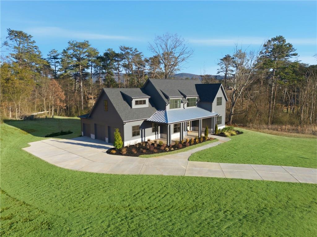 157 Palisade Drive Rydal, GA 30171 - Photo 5 of 68 a front view of a house with a yard and trees
