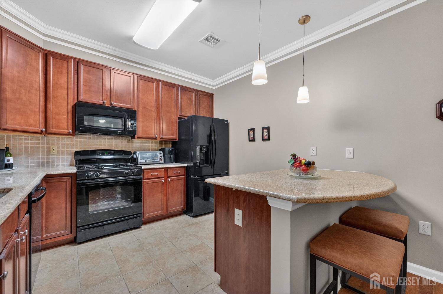 417 Regency Place Woodbridge, NJ 07095 - Photo 12 of 28 a kitchen with appliances cabinets and furniture