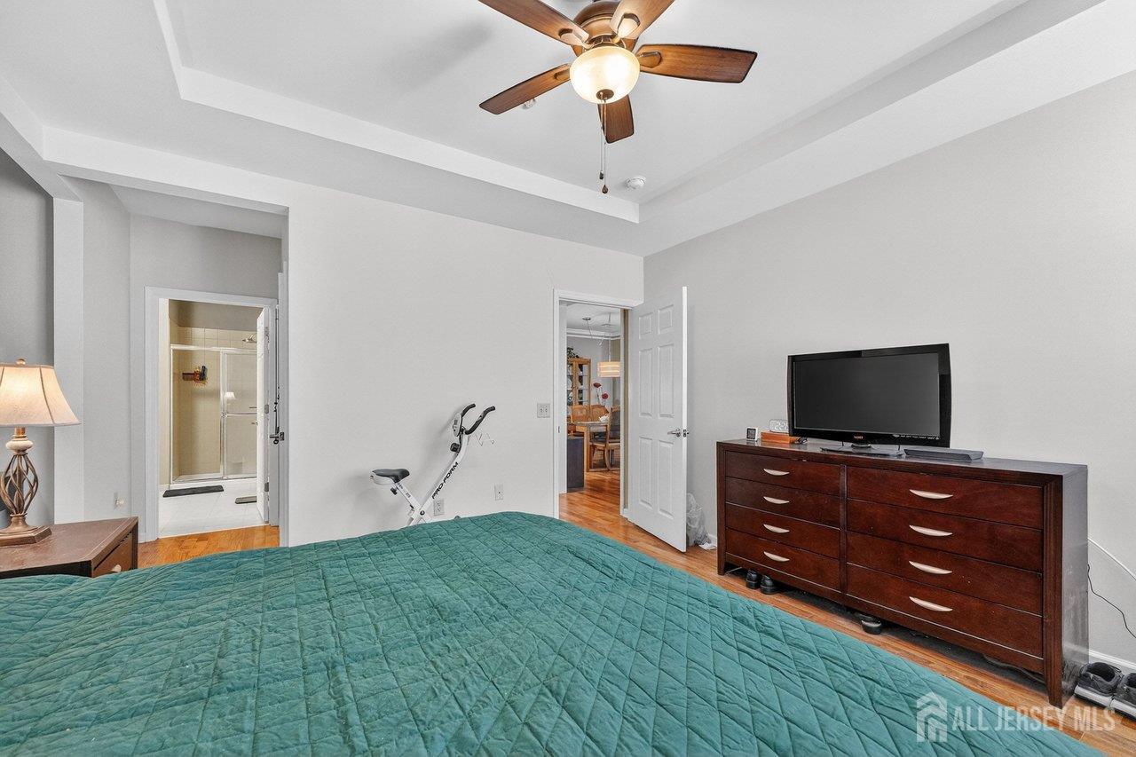 417 Regency Place Woodbridge, NJ 07095 - Photo 15 of 28 a living room with furniture and a flat screen tv