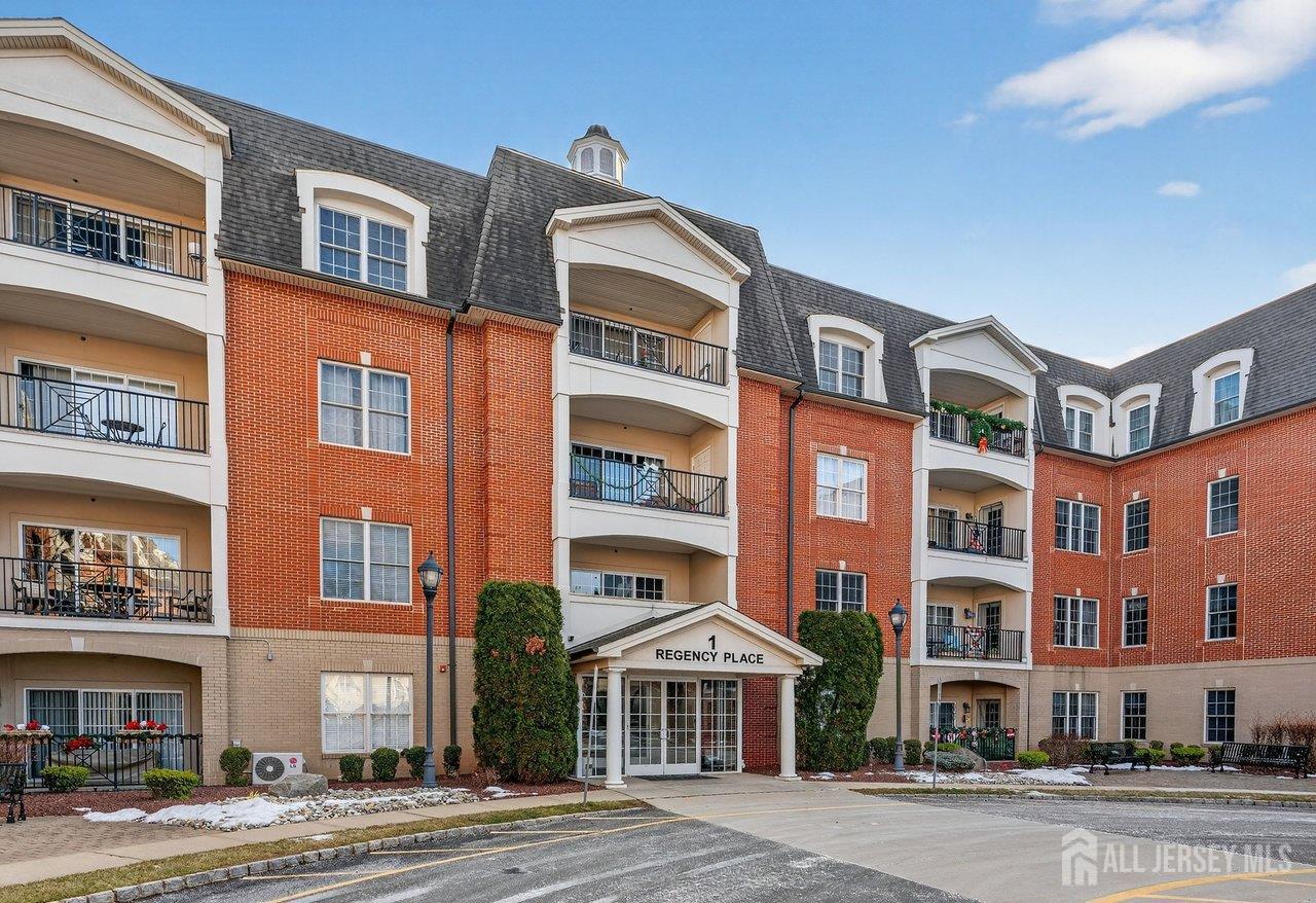 417 Regency Place Woodbridge, NJ 07095 - Photo 2 of 28 a front view of a multi story building