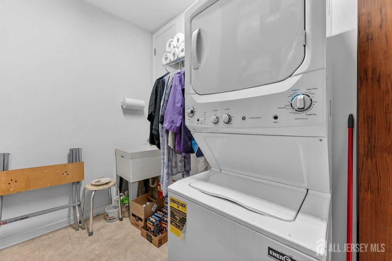417 Regency Place Woodbridge, NJ 07095 - Photo 21 of 28 a utility room with dryer and washer