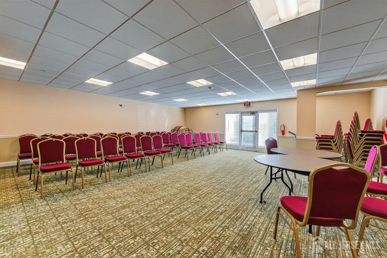417 Regency Place Woodbridge, NJ 07095 - Photo 25 of 28 a room with lots of furniture and air hockey table