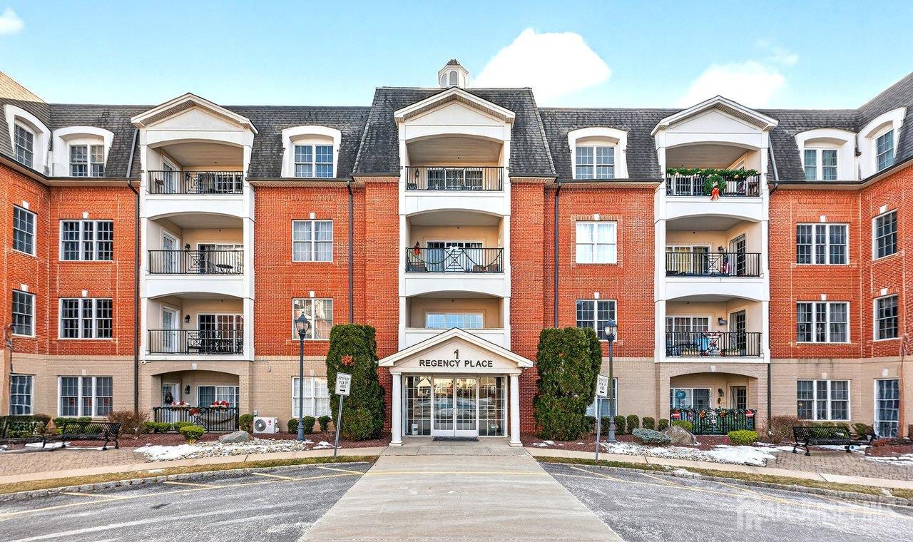 417 Regency Place Woodbridge, NJ 07095 - Photo 3 of 28 a front view of a multi story building