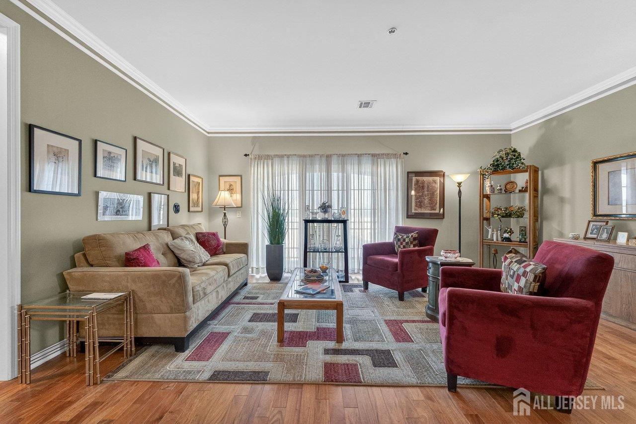 417 Regency Place Woodbridge, NJ 07095 - Photo 6 of 28 a living room with furniture and a wooden floor