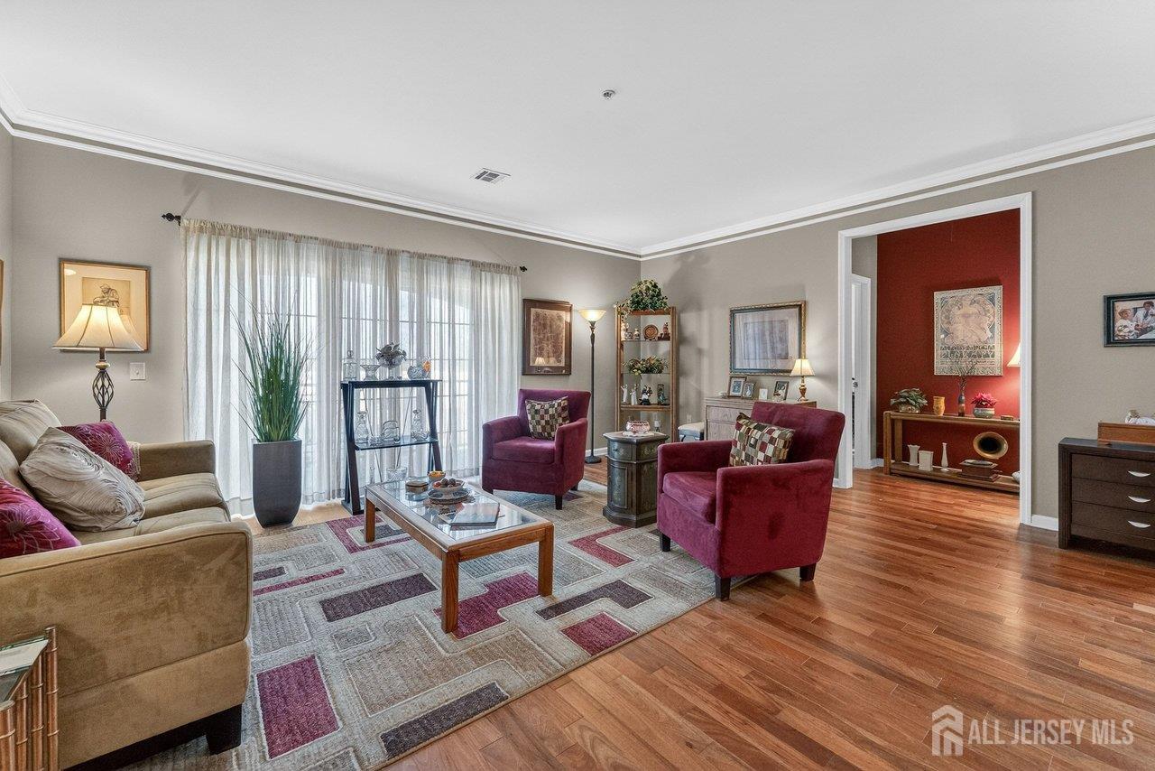 417 Regency Place Woodbridge, NJ 07095 - Photo 7 of 28 a living room with furniture and wooden floor