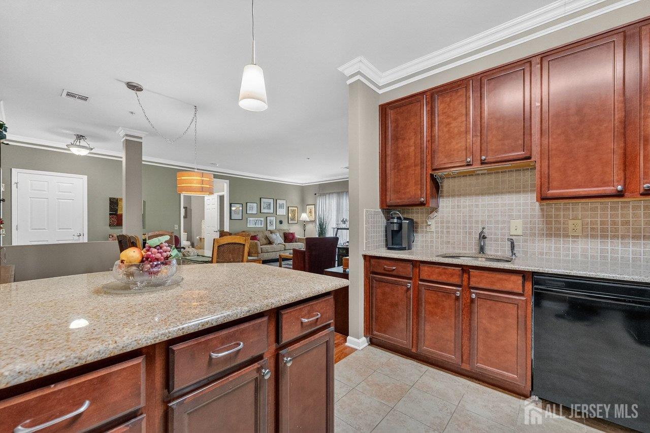 417 Regency Place Woodbridge, NJ 07095 - Photo 9 of 28 a kitchen with sink and cabinets