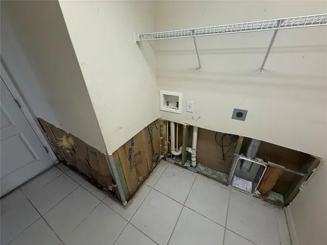 a view of an empty room with a utility room