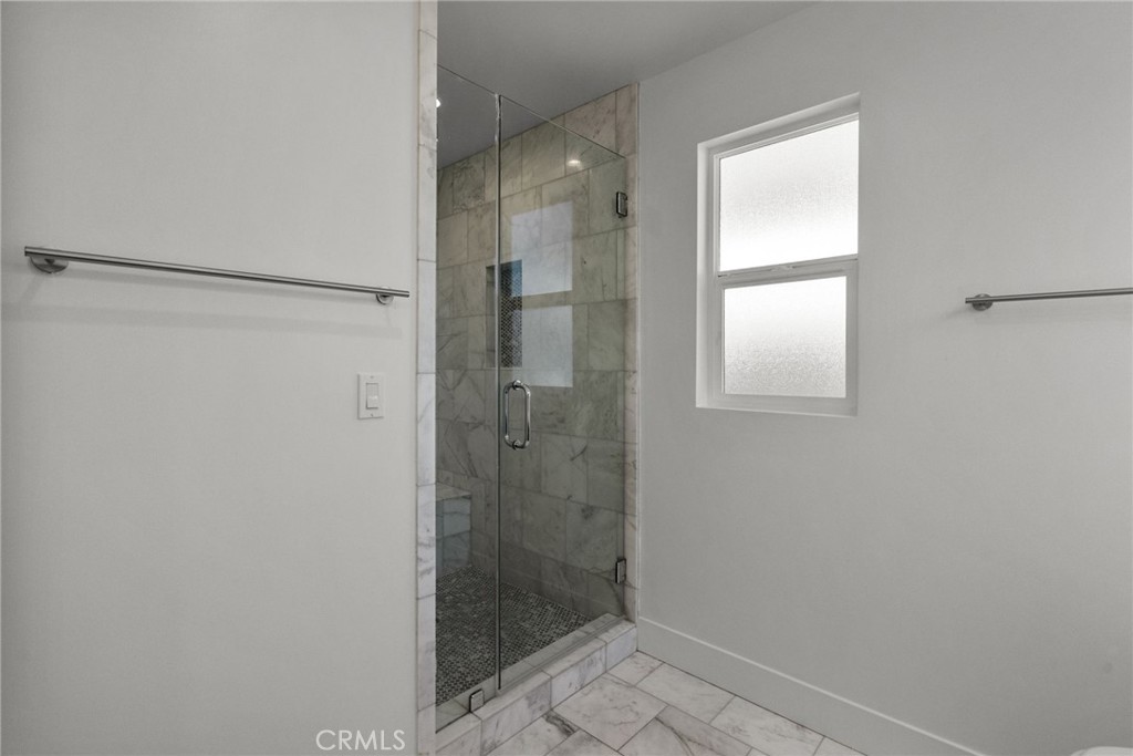 16863 Balboa Boulevard Van Nuys, CA 91406 - Photo 23 of 34 a bathroom with a glass shower door