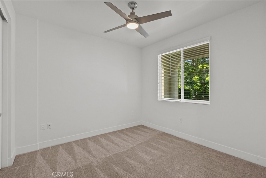 16863 Balboa Boulevard Van Nuys, CA 91406 - Photo 24 of 34 an empty room with a window and a ceiling fan